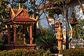 Vientiane, Laos - Pha That Luang, Other structures on the ground include a bell tower, several stupas, a number of pavilions sheltering images of the Buddha.  